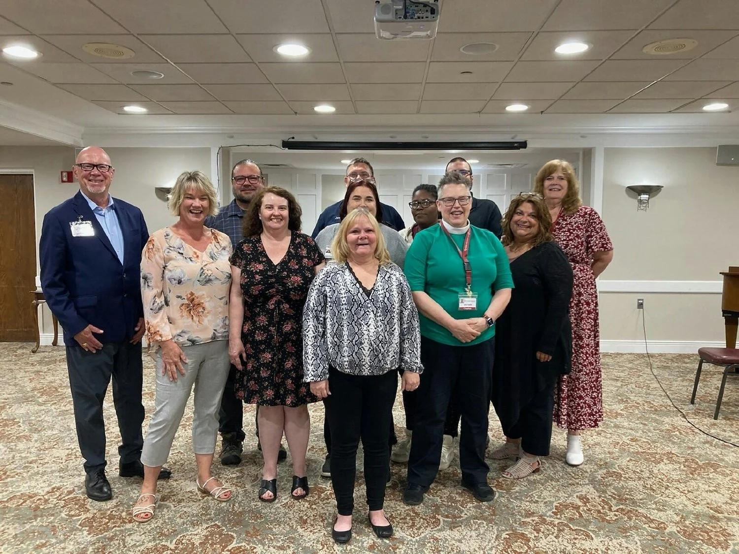 A joyful time at a ceremony recognizing employees who completed a group workshop program at Redstone