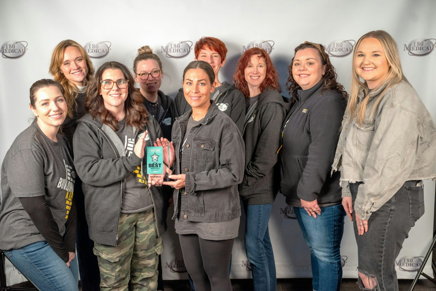 Some of our 180 women posing with our 2024 Fortune Best Workplaces for Women award!