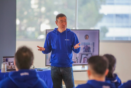 CEO, Yisu Jin, presenting at an all-hands meeting in the Santa Clara office