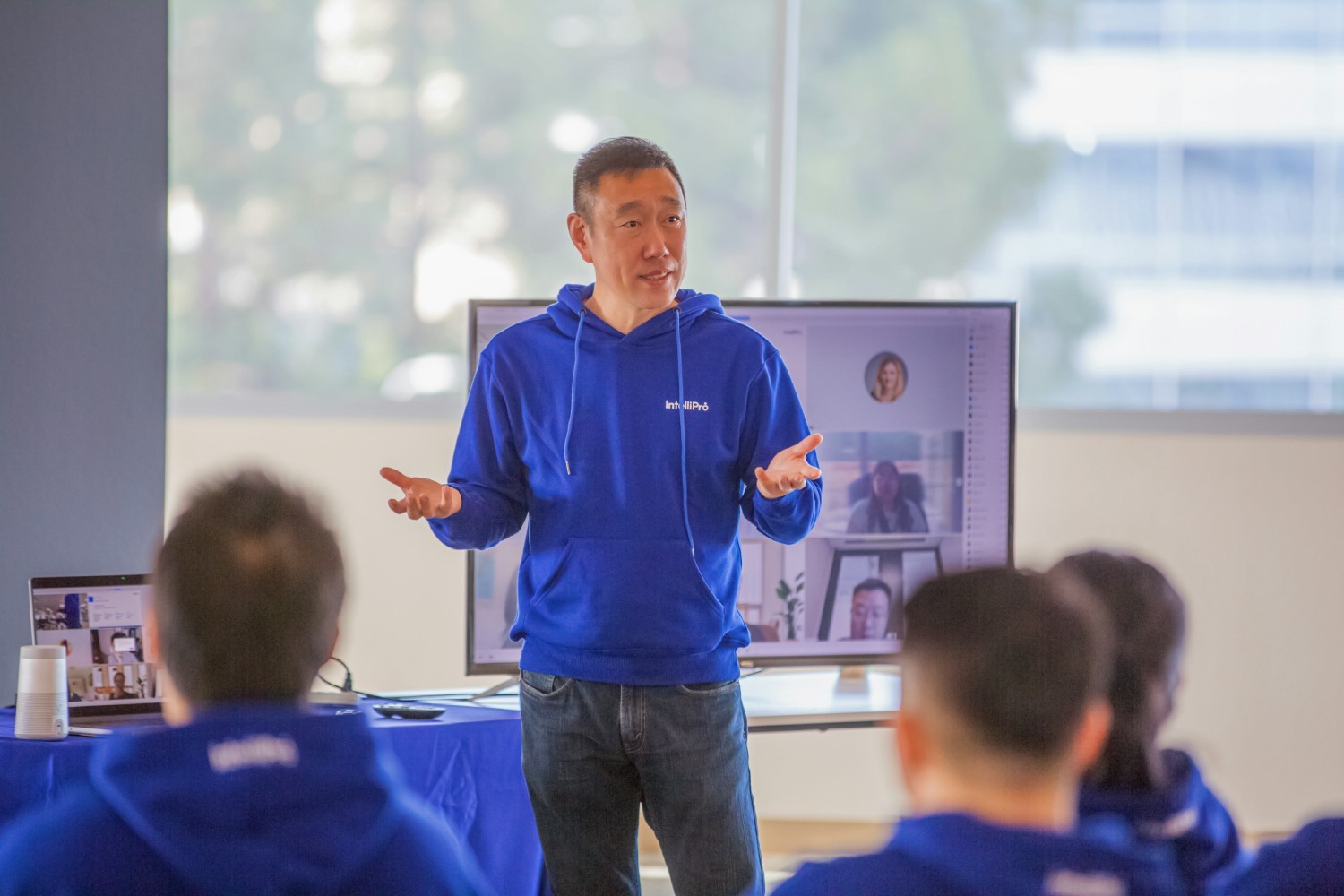 CEO, Yisu Jin, presenting at all-hands meeting in Santa Clara