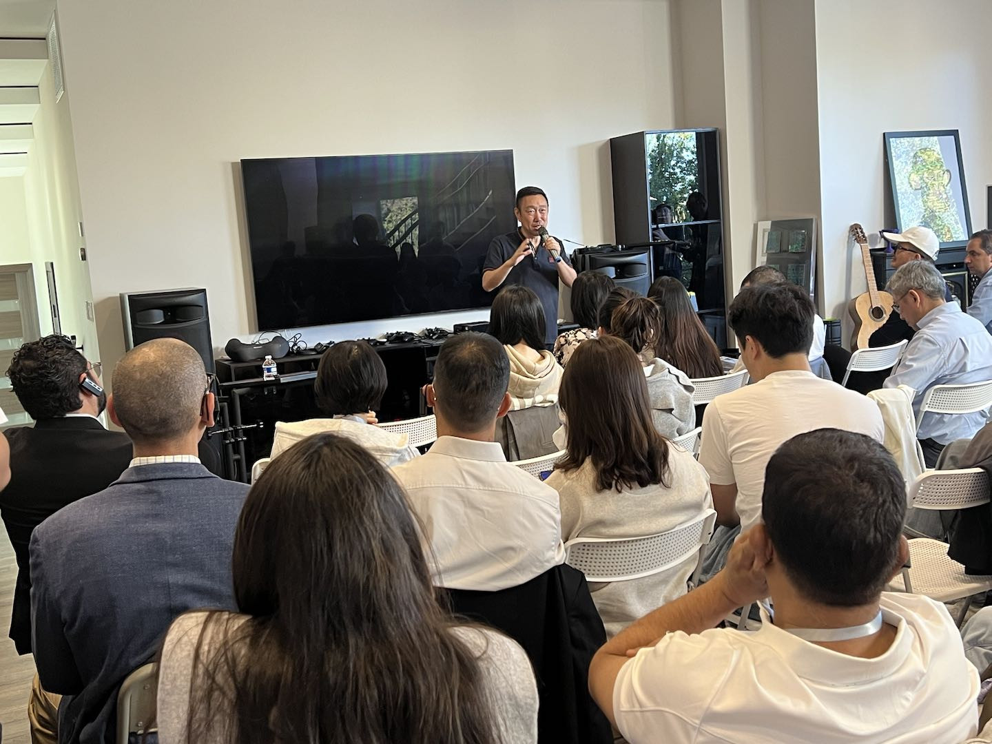 CEO, Yisu Jin, presenting in a business networking event in Silicon Valley