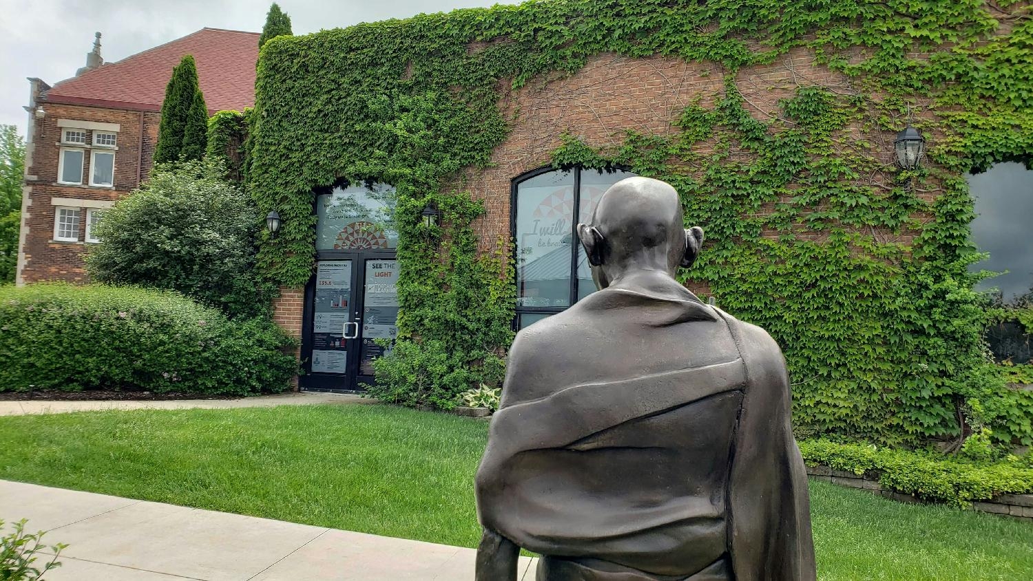 The serendipity of a Gandhi statue placed by our front door's equity messaging campaign for the Chelsea Sculpture Walk.