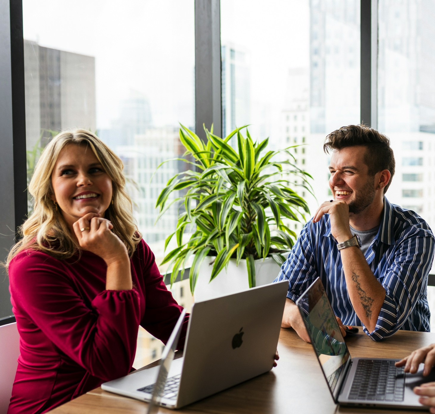 Two employees catch up in a communal meeting space at the Austin office.