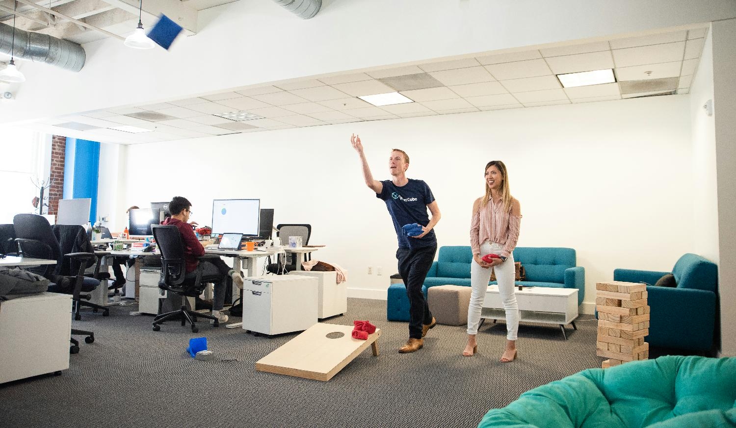 CEO and Executive Assistant playing cornhole in our San Francisco office.