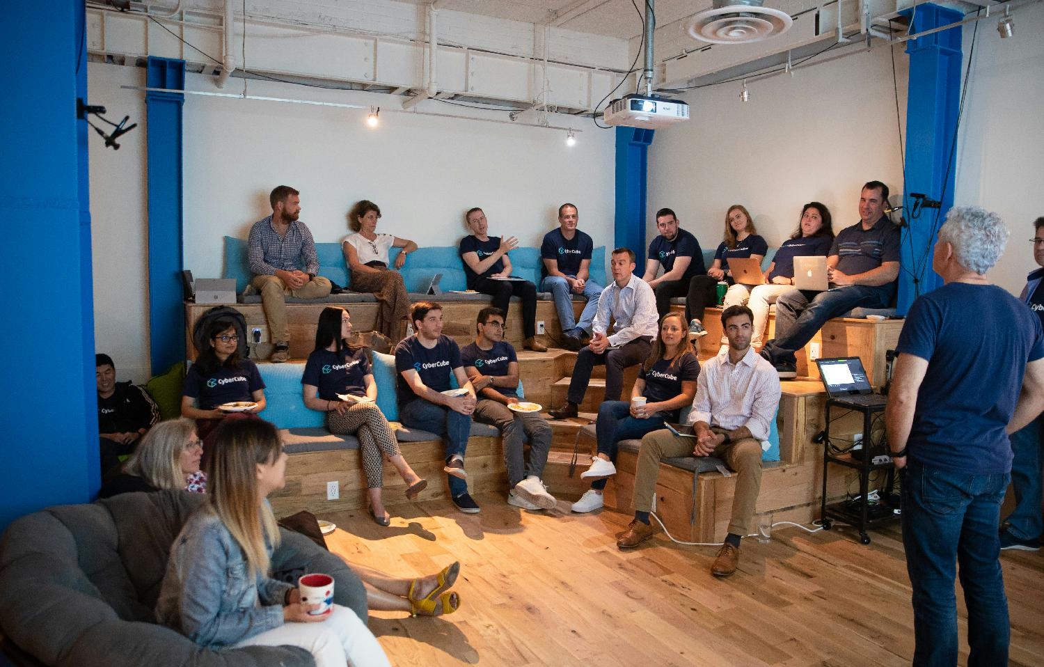 Wednesday company briefing meeting in the common area in San Francisco HQ. 