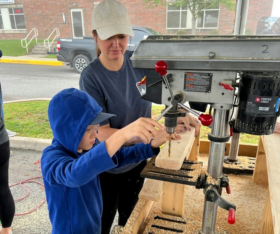 MVB team members and their families gathered for a bed building event for children that don't have beds of their own.