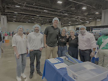 Axonians in Washington, DC volunteering with 9/11 Day Org to pack non-perishable meals.