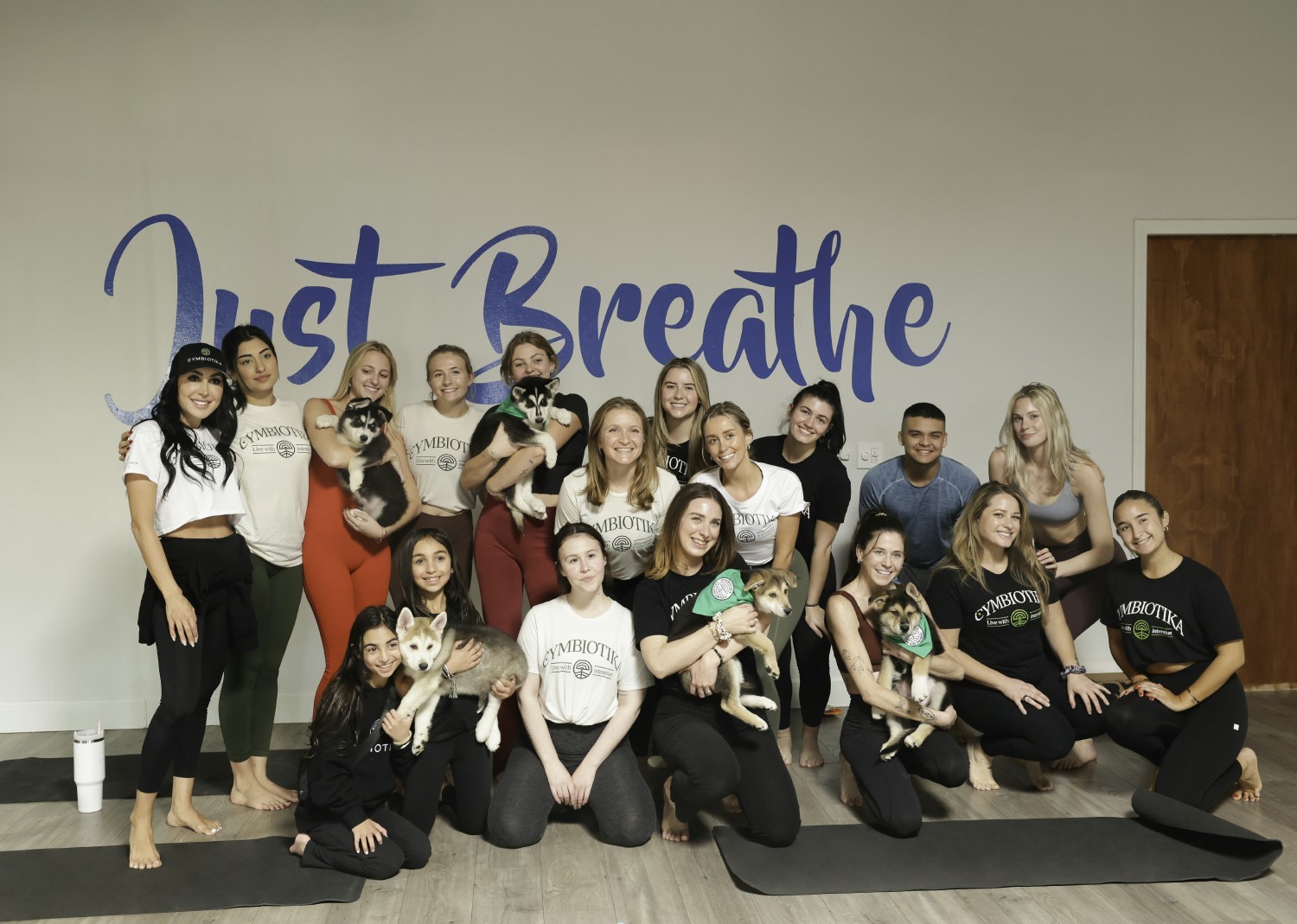 Cymbiotika team members at a fundraising yoga event for an animal rescue.