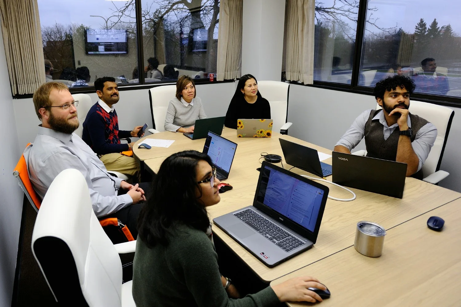 Collaborating & innovating together. Productive team meeting as we brainstorm new ideas and tackle challenges head-on.