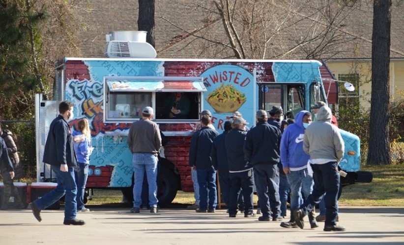 Benton, Arkansas employees enjoying lunch from a food truck following a Town Hall visit from CoorsTek executives.