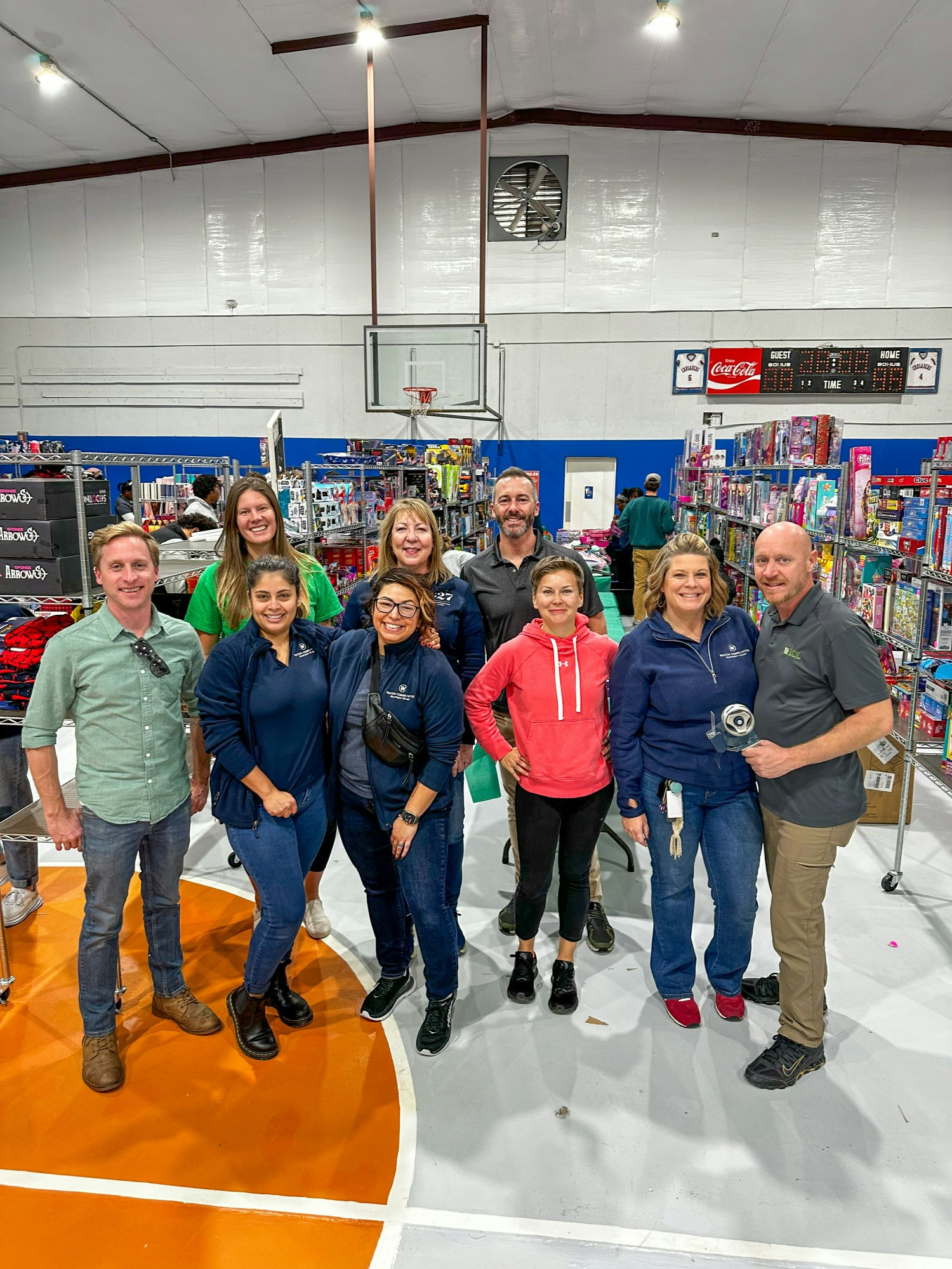 Walton Communities team members serving at the annual Christmas Market with non-profit partner, Mission 1:27.