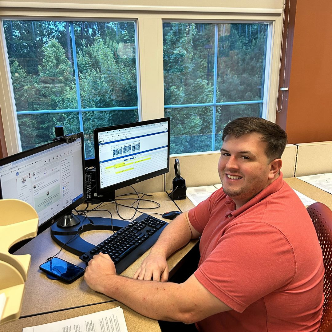 All smiles after a promotion and new desk! 