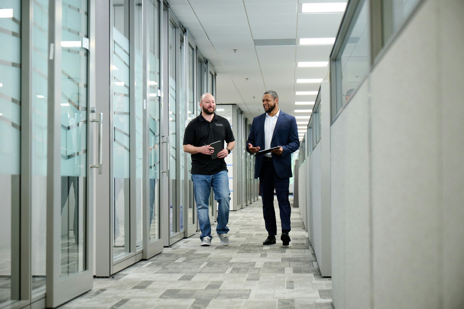 Two Trane Technologies employees have a conversation at work