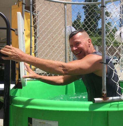 CEO Frank Archer in dunk tank at employee event