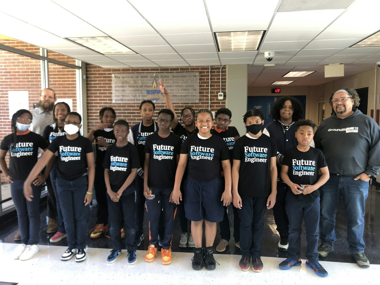 Our engineering team volunteering at a local elementary school teaching code to middle schoolers!