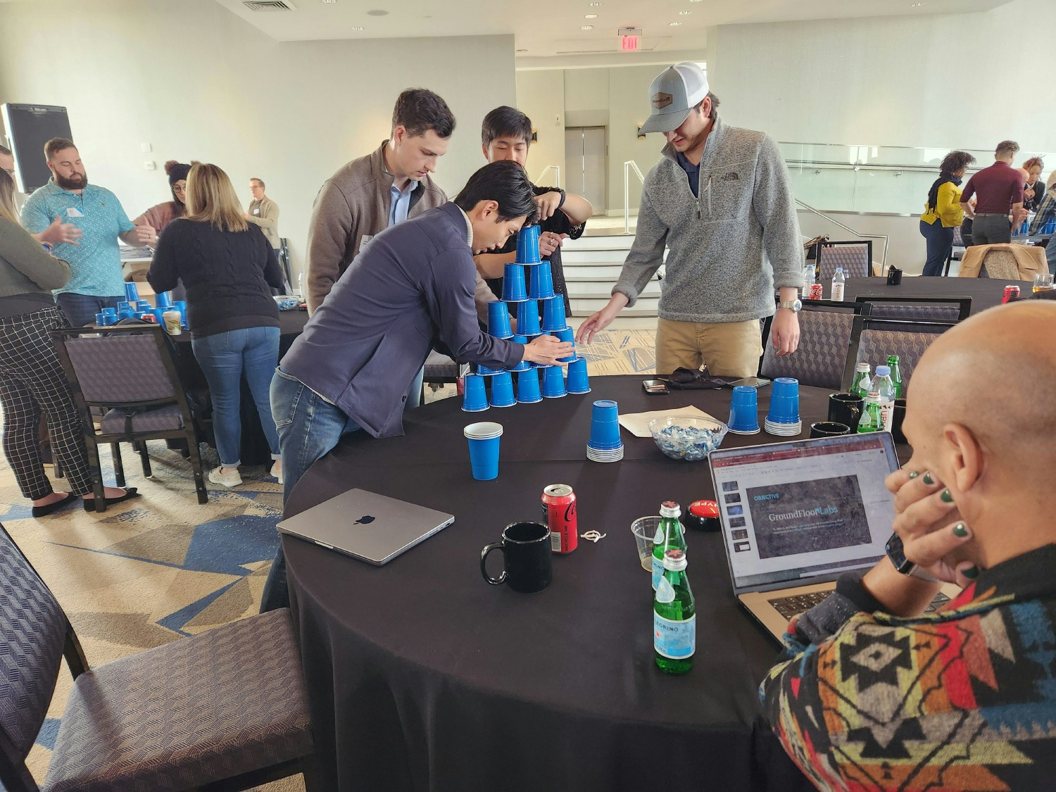 Our Labs team hard at work in a cup stacking competition.