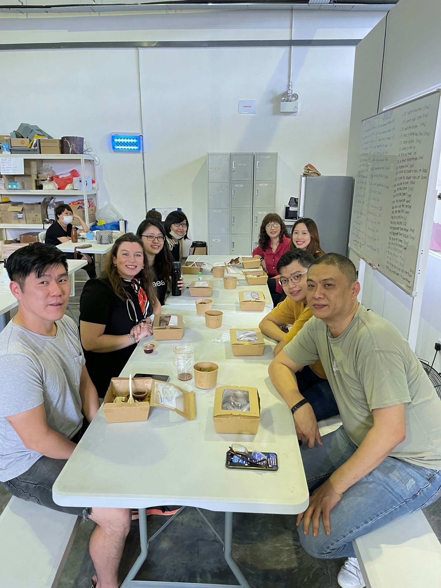 Our team in Singapore enjoying a group lunch in the warehouse.