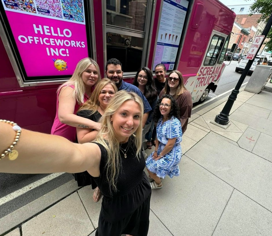 OW office celebrating National Ice Cream Day with a surprise ice cream truck with Officeworks name on the big screen.