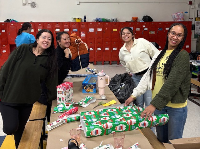Staff came together at our Holiday Wish event to wrap gifts for the children and families we serve