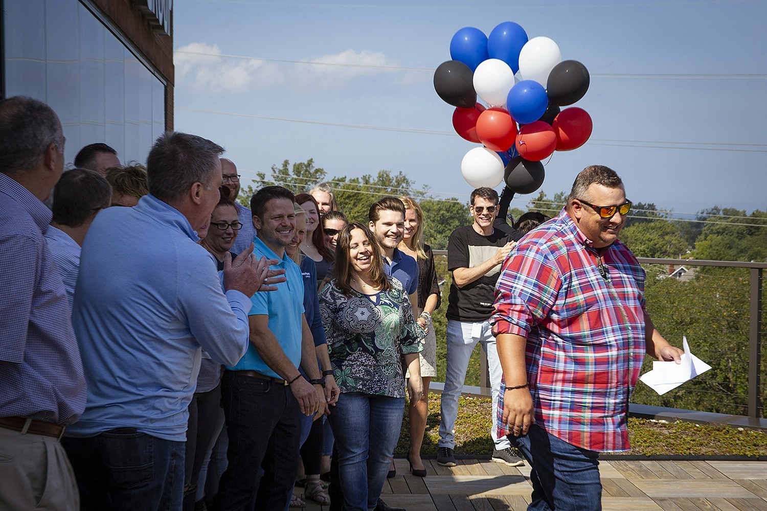 ContainerPort Group President Joey Palmer + employees gather to announce the winner of a new Harley, September 2021. 