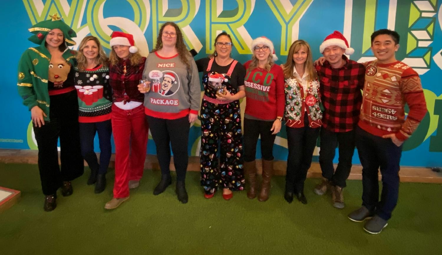 Enjoying each other's company with a fun tacky sweater holiday party for team members out west!