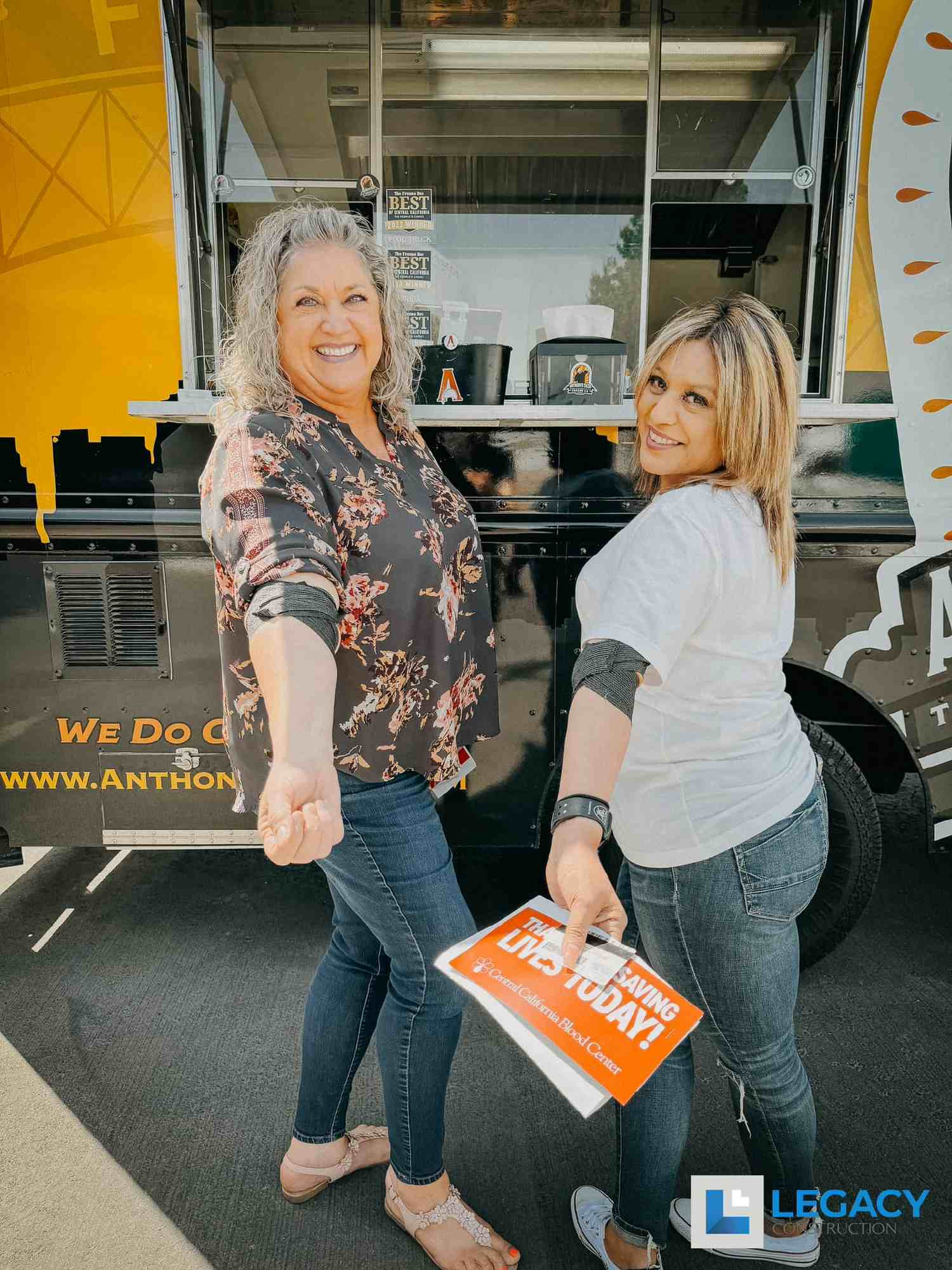 Heather and Rosemary showing off their bandages after participating in our annual blood drive.