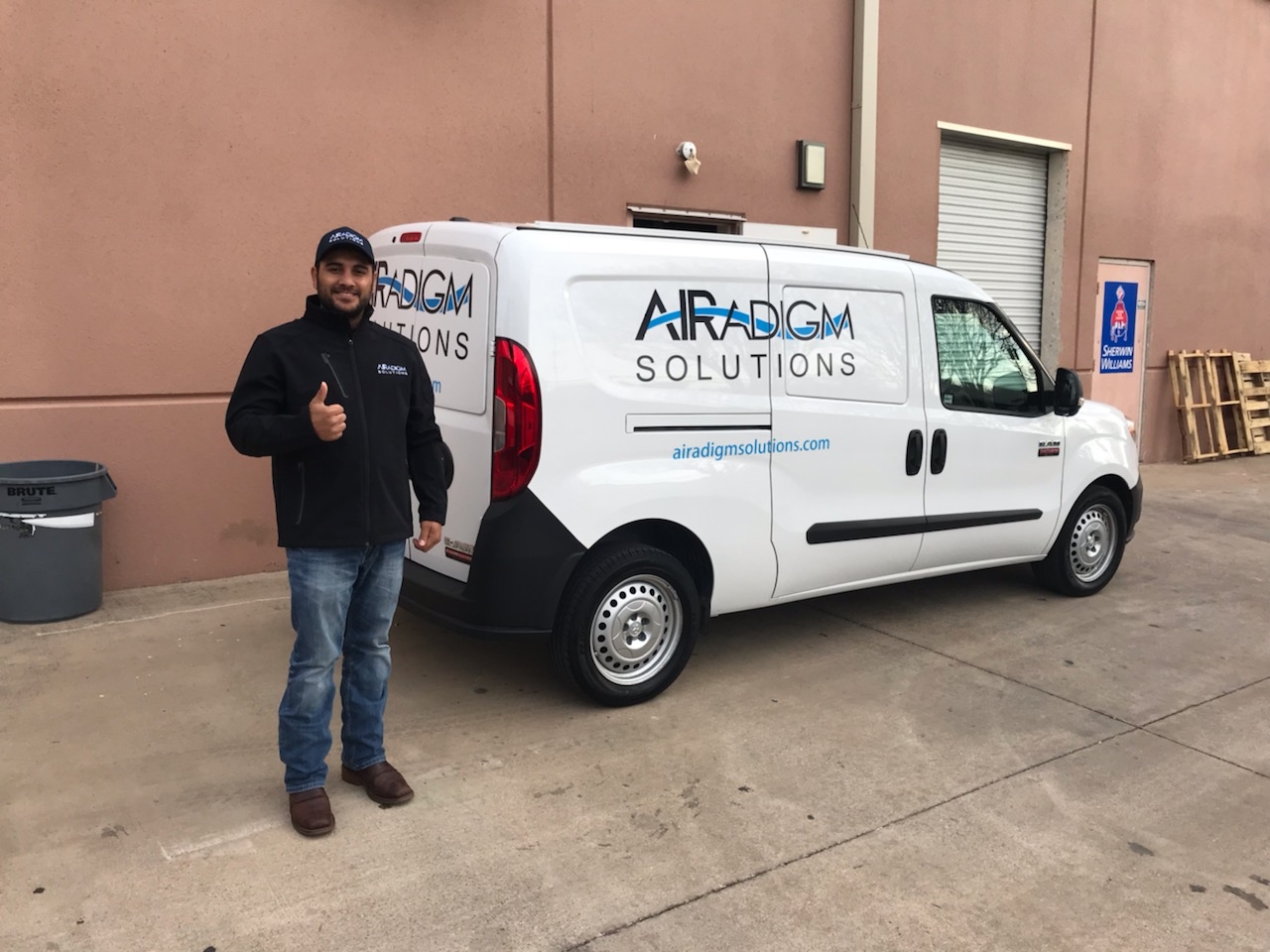 Air Balancing Technician with a company van.