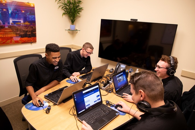 Team members improving their skills through Encore University courses