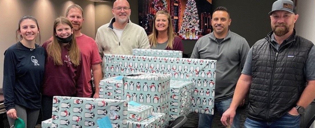 Wrapping gifts for Rocky Mountain Children Health Foundation.