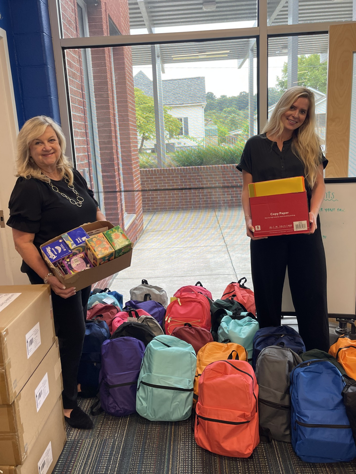 Filling backpacks for underprivileged school children.
