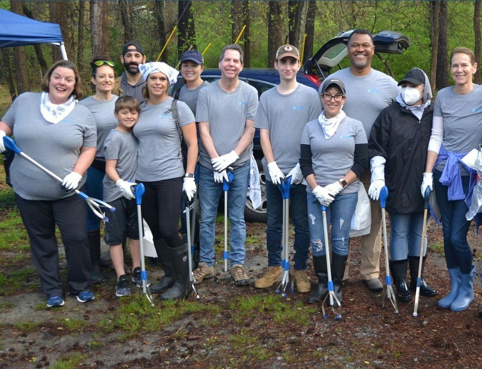 Our Builders employees giving back to the community by participating in Sweep the Hooch and cleaning up the river.