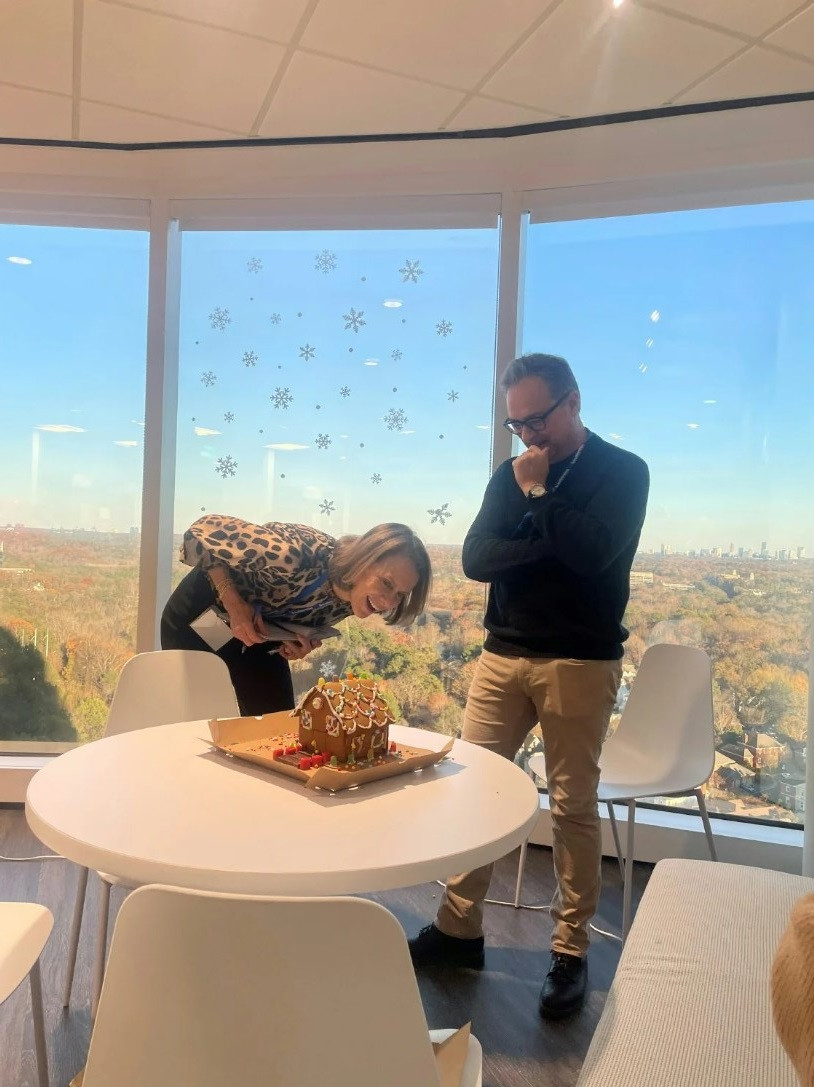 Our CEO and Chief of Staff Judging our Gingerbread Contest at our last BuildersFest Celebration!