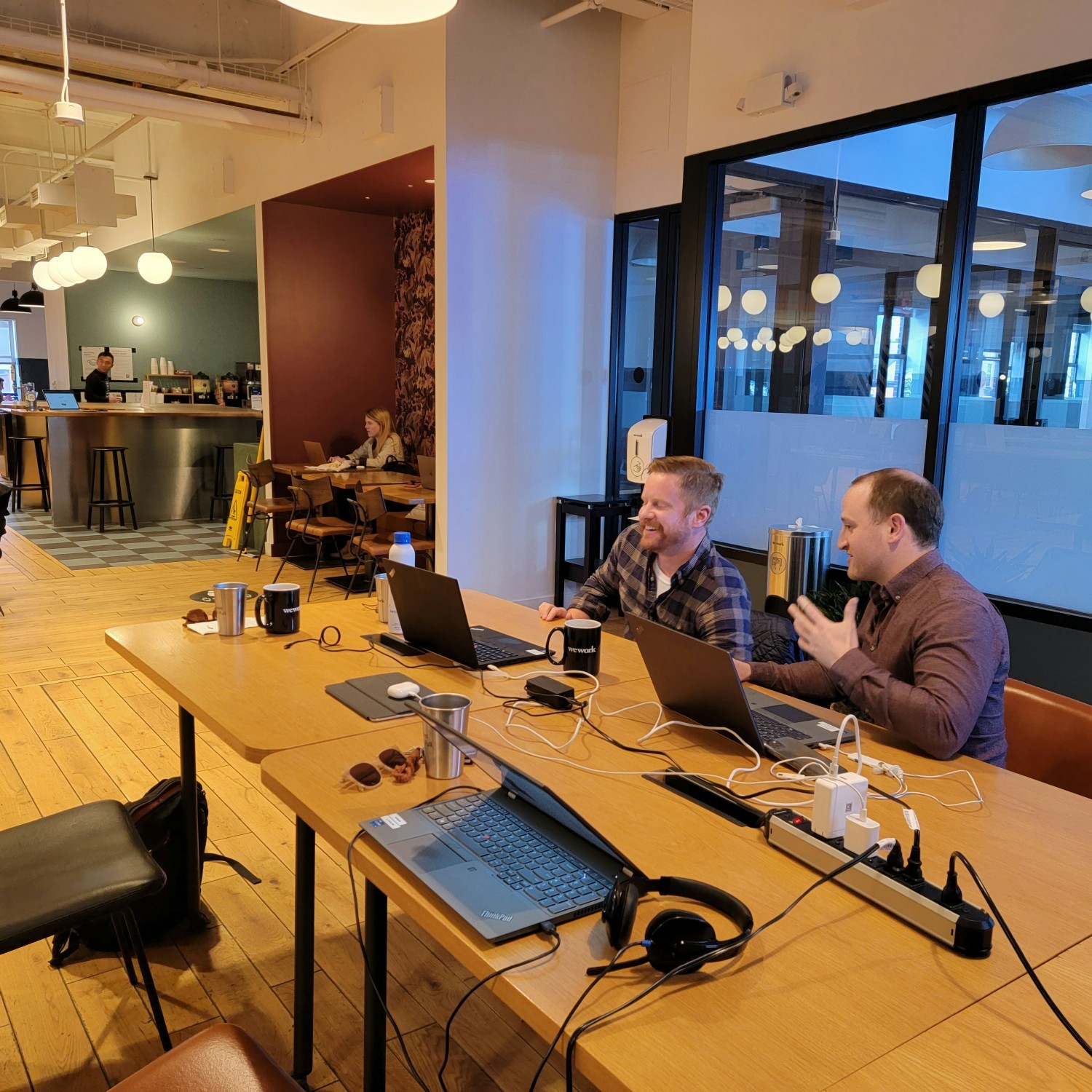Remote workers enjoying co-working space in Boston