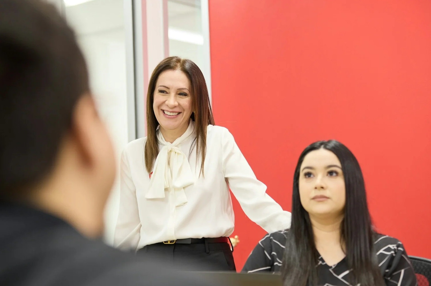 Optimum's CEO, Nooshin Yazhari, joining the team for a collaboration session in the office.