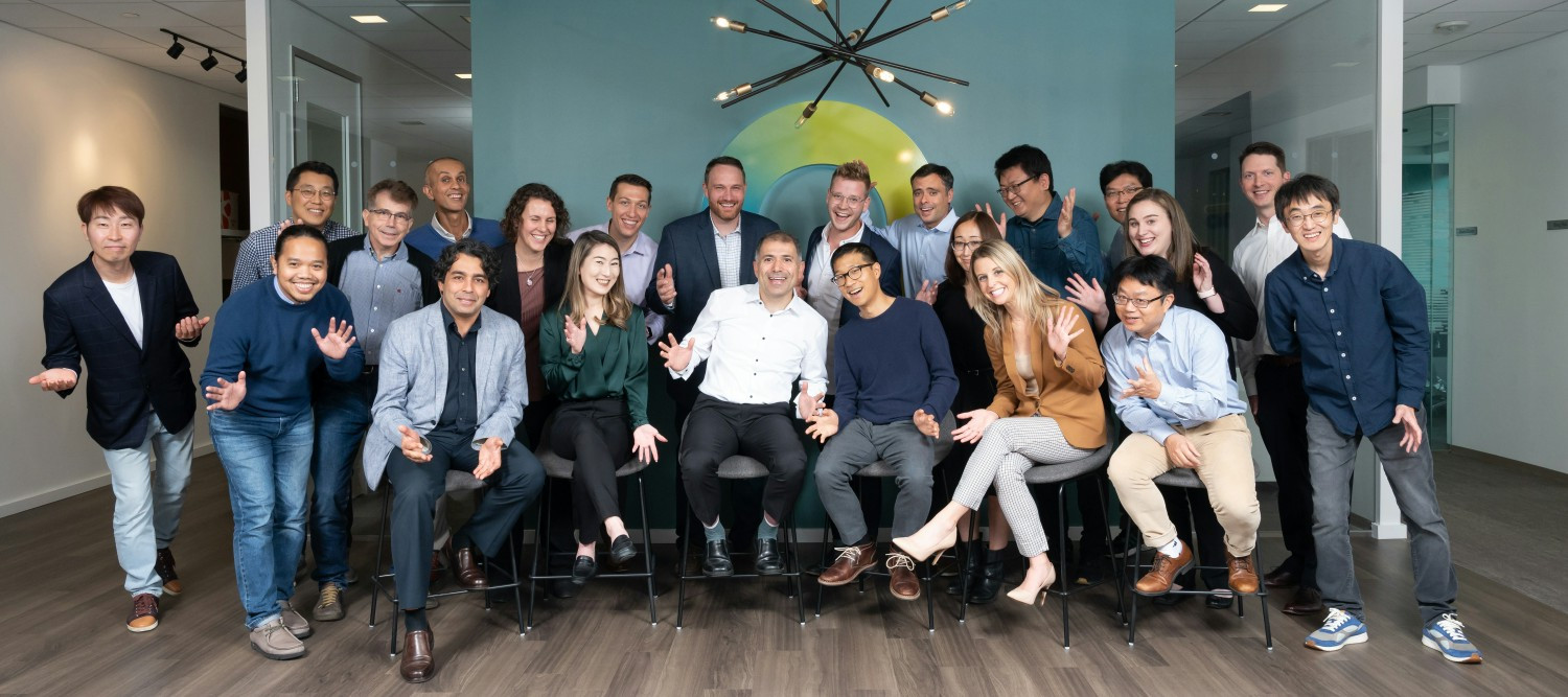 Ofinno employees working in a meeting room