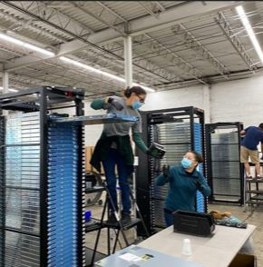 Sprout members in North Carolina working on harvesting parts from servers for reuse.