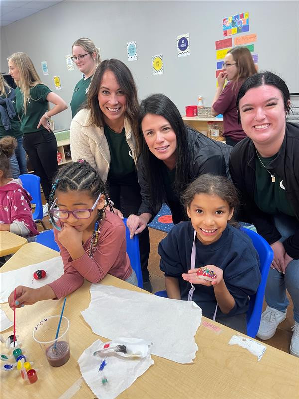 Employees volunteering with at risk youth.
