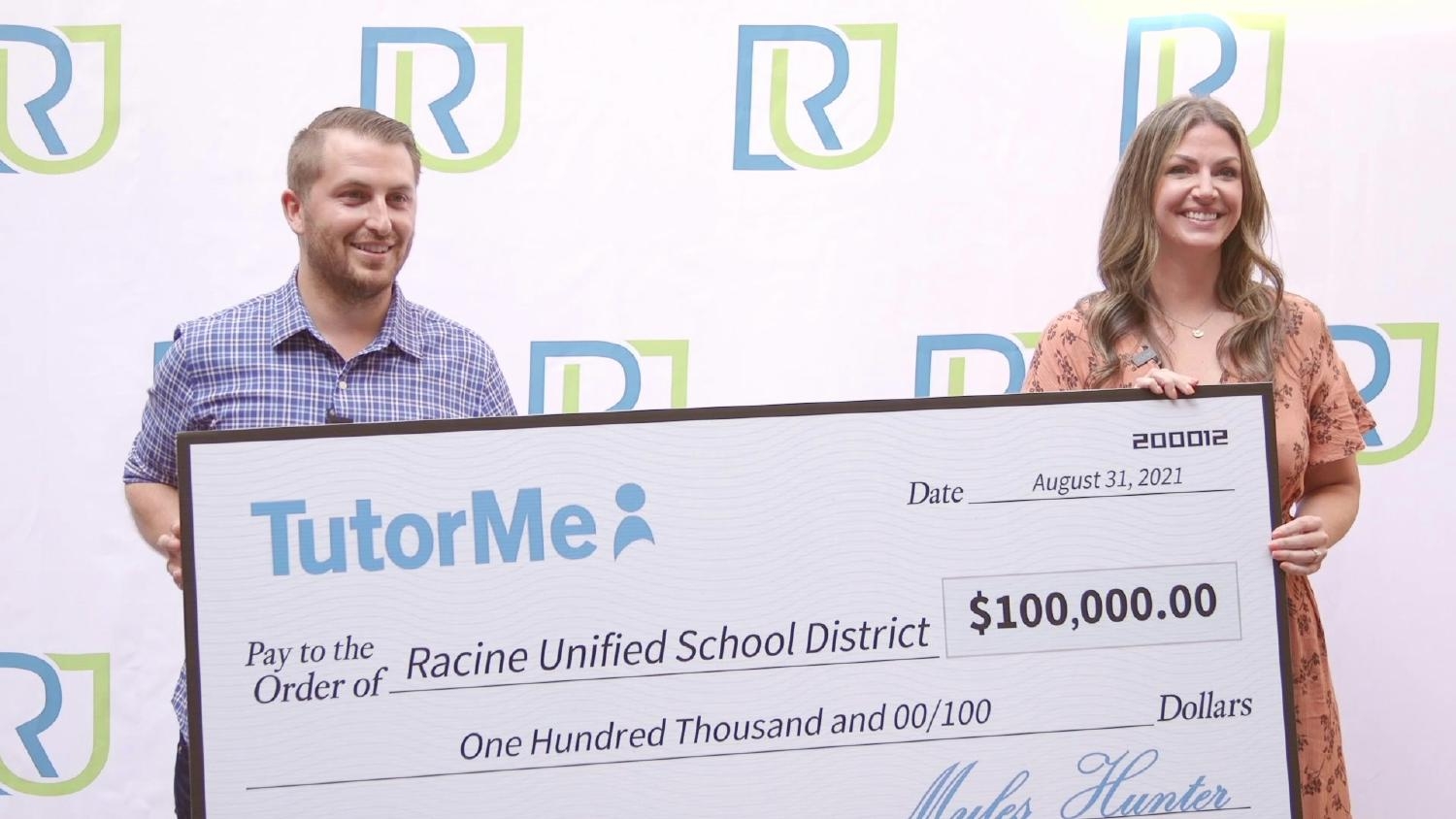 Co-Founder & CEO Myles Hunter presenting $100,000 in online tutoring to Racine Unified School District.