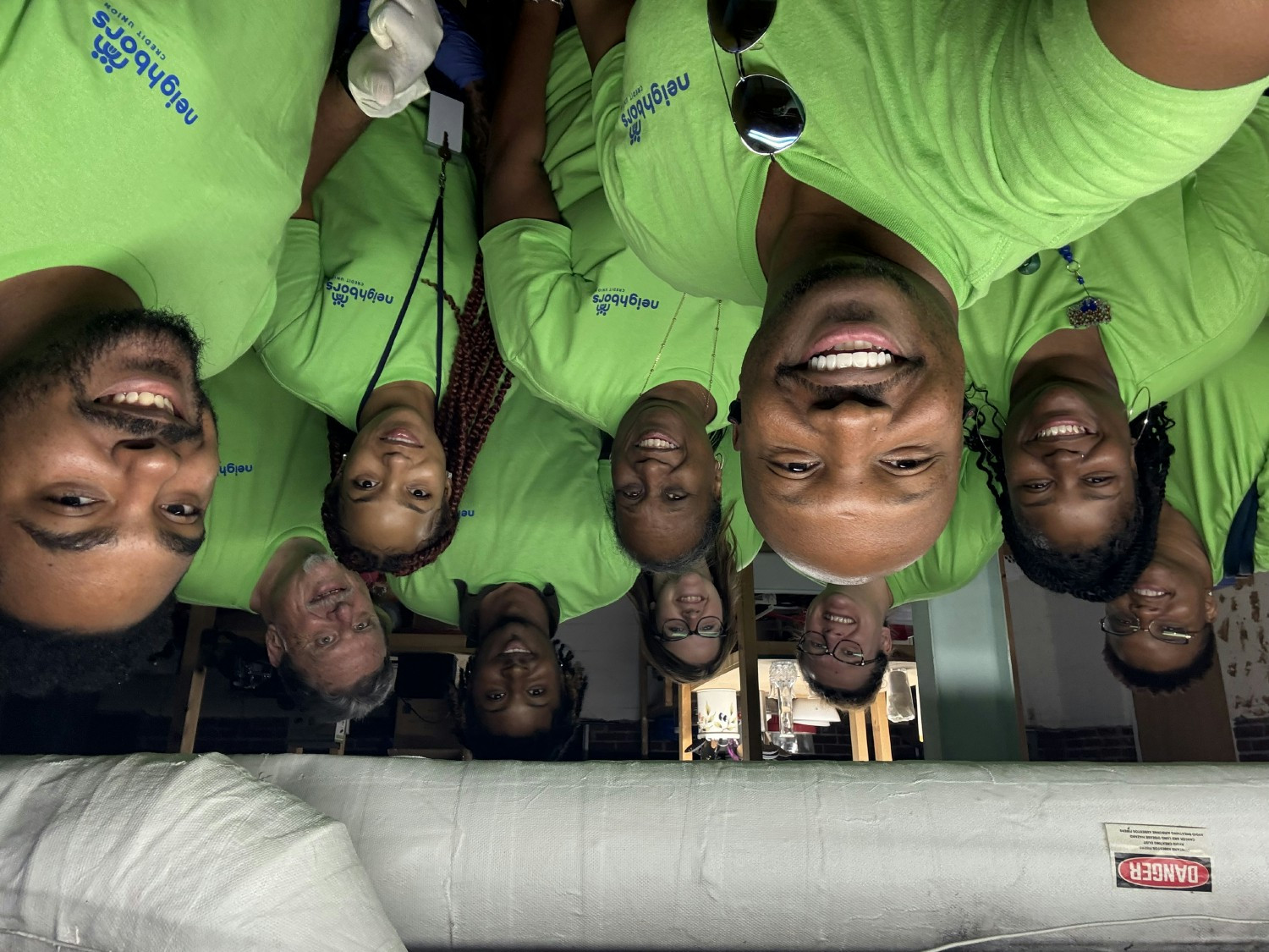 Neighbors Credit Union team members are all smiles after wrapping up a volunteer shift at Youth In Need.
