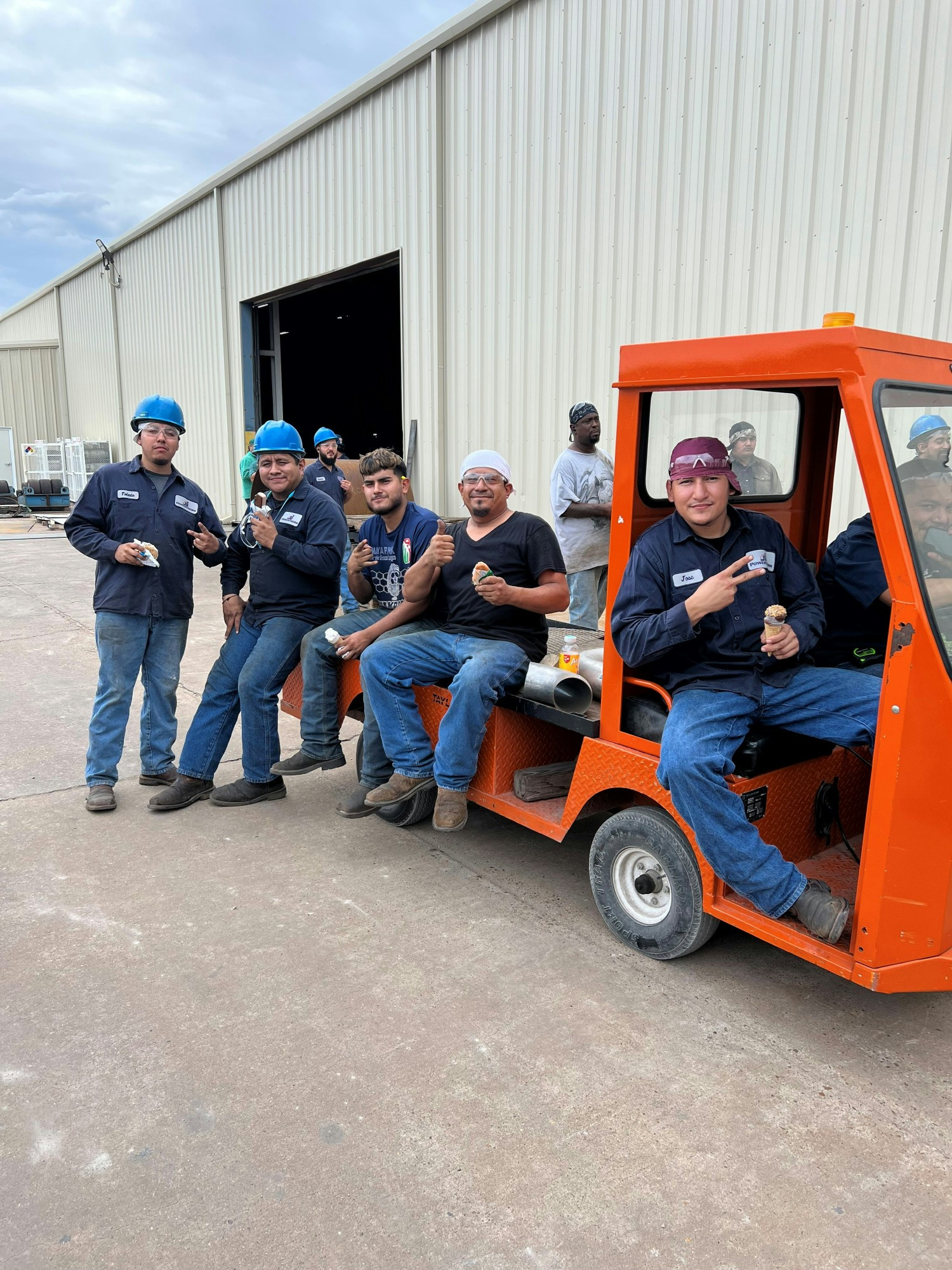 Employees with product about to ship in Tulsa, OK.