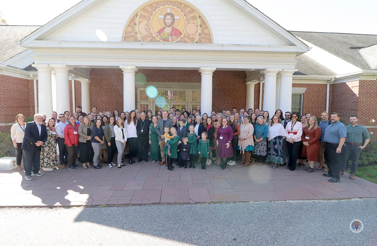 Ascension team members, joined by family and friends, gathered for a group photo after a meaningful retreat morning.
