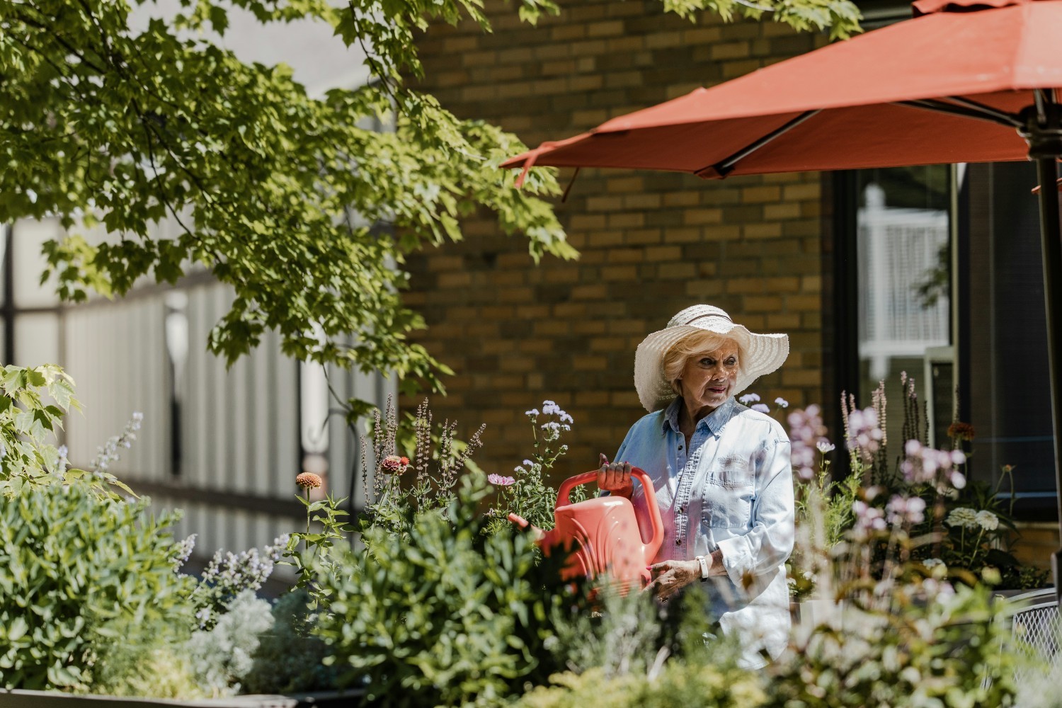 Residents enjoy gardening with their own plot in the community garden or in easy-to-access raised boxes.