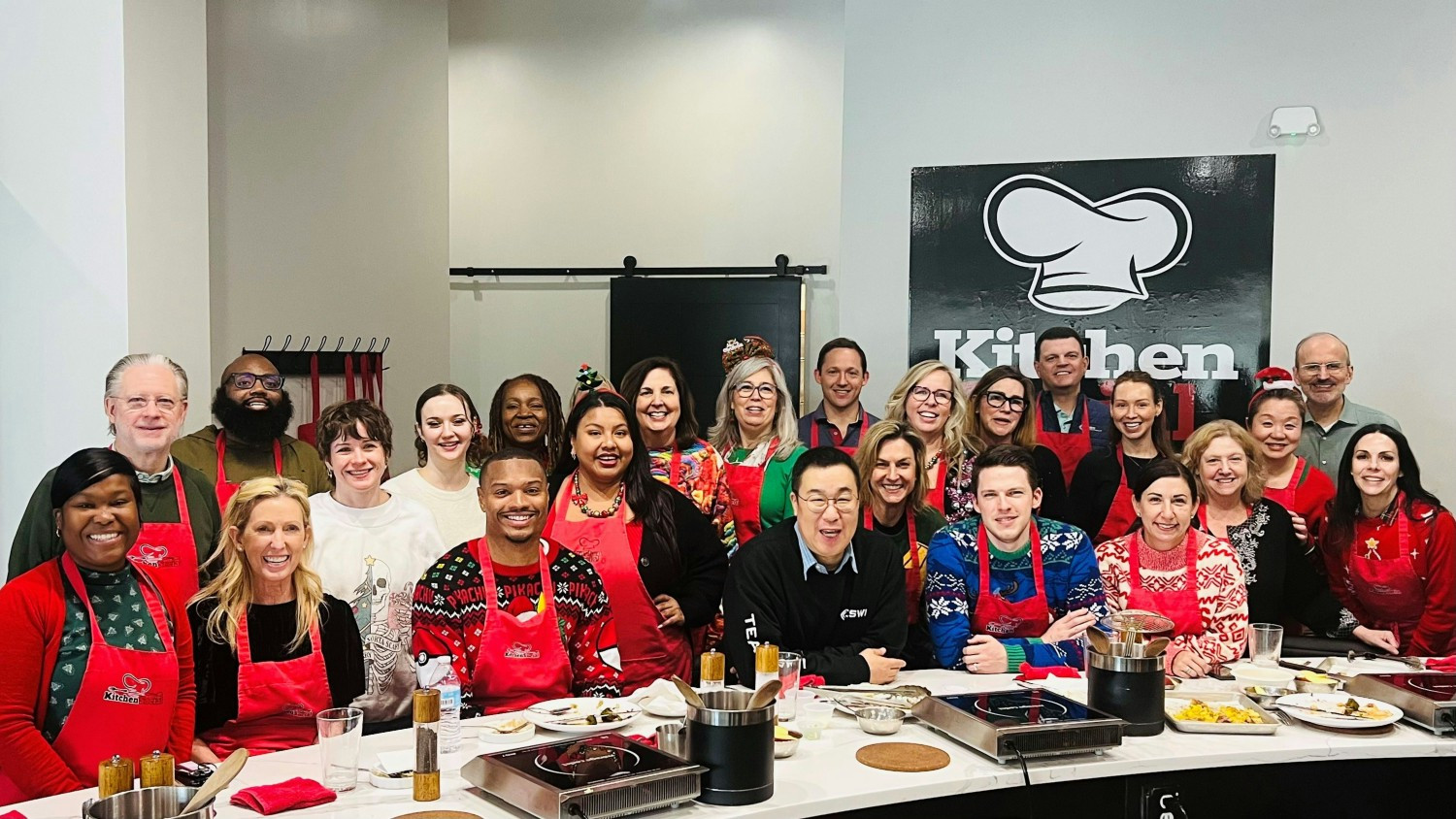 When colleagues gather off-campus to prepare a delicious holiday lunch, there are never too many cooks in the kitchen!