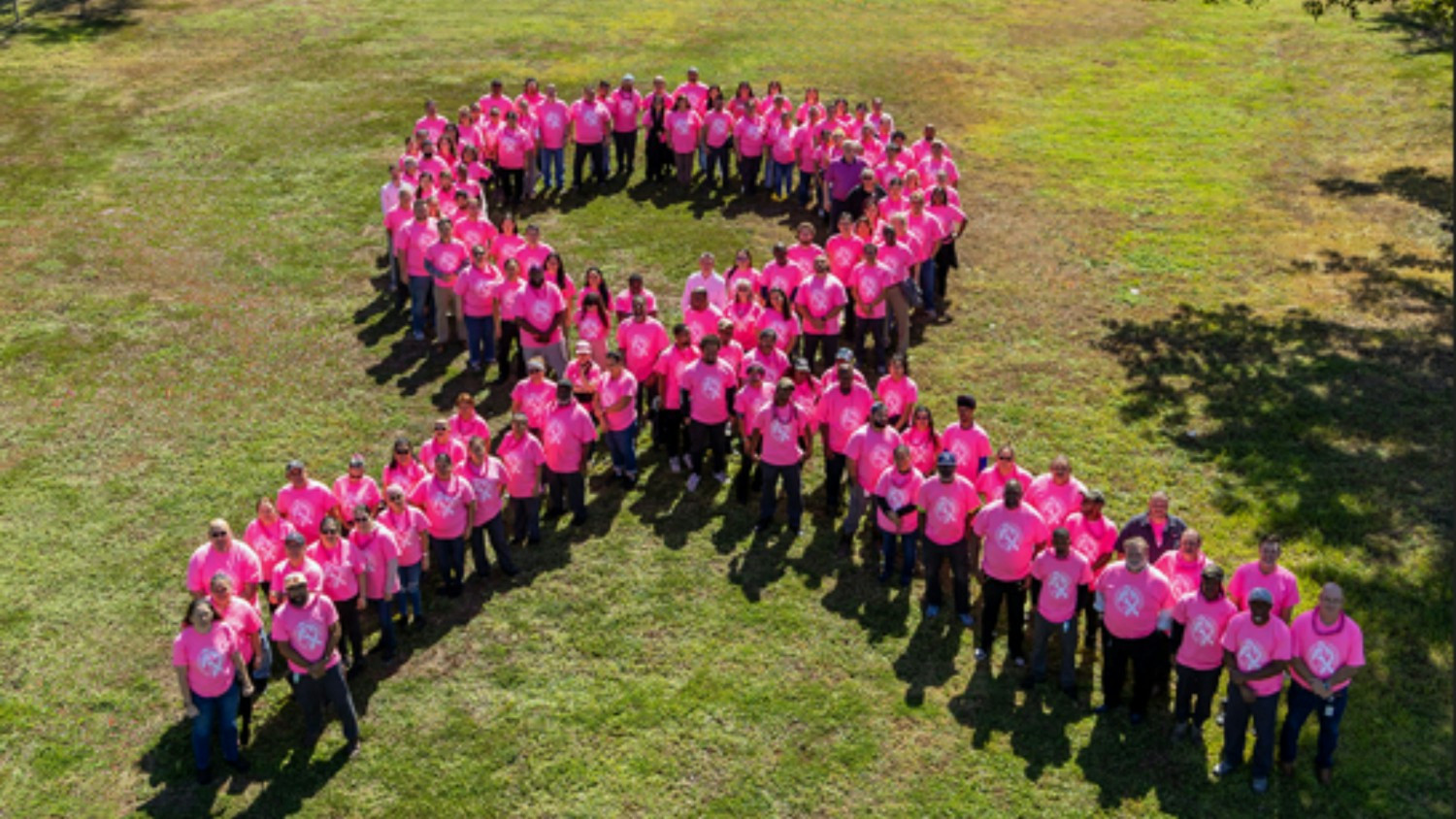 A photo of 100 employees is worth a thousand words about compassion and collaboration.
