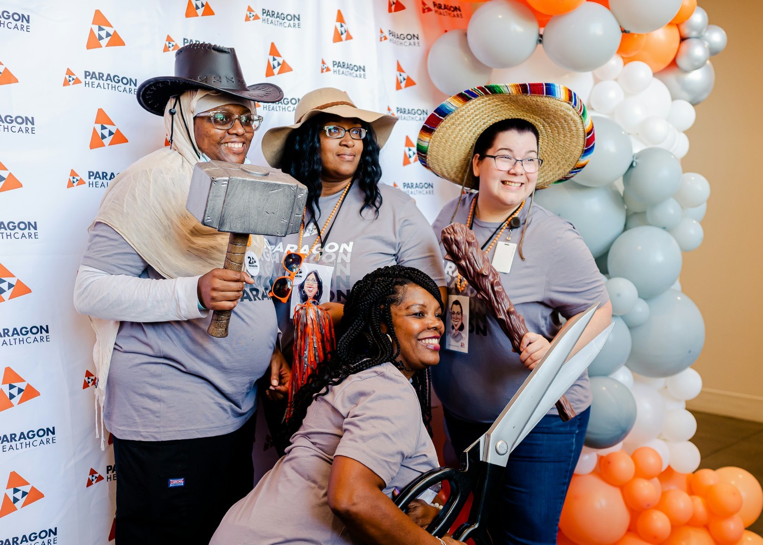 Paragon employees in the photo booth for our 20th Anniversary Celebration, September 2022