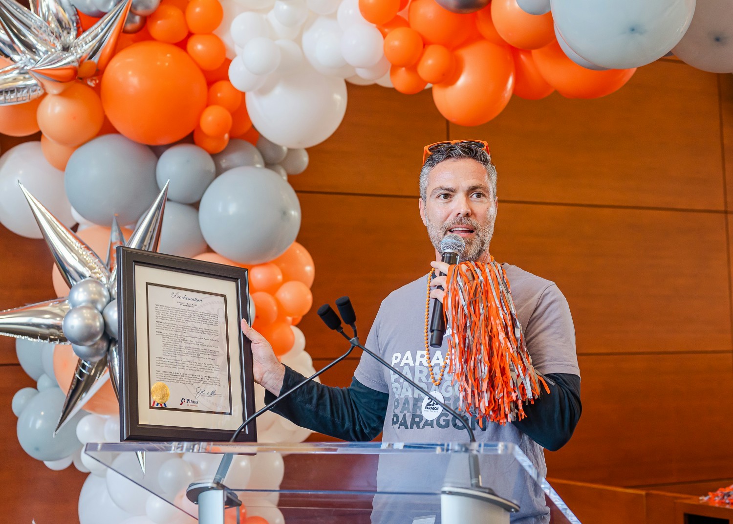 CEO Anthony Mollica holding a proclamation from the City of Plano declaring September 16, 2022 as Paragon Healthcare Day