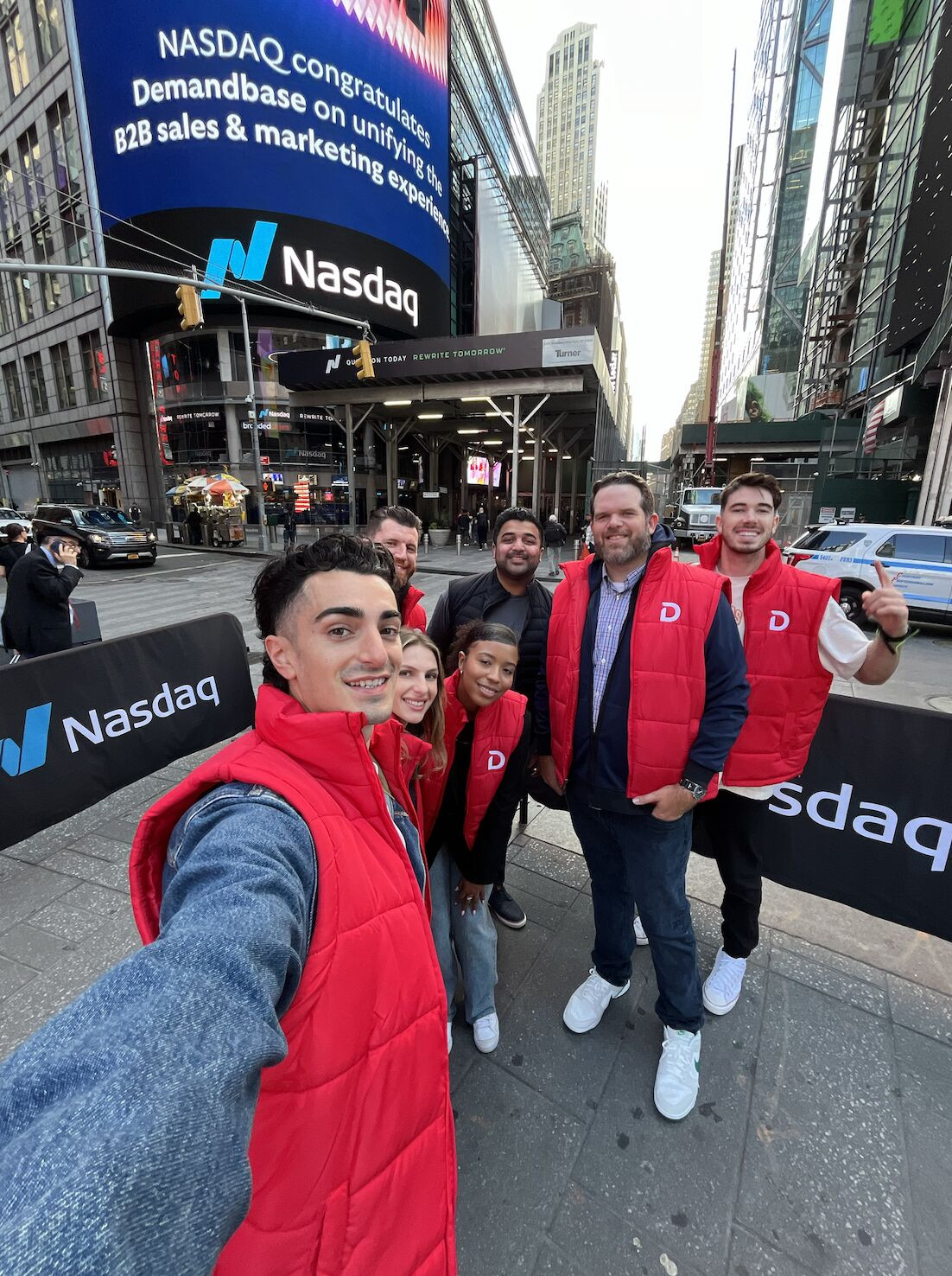 Marketing Team members seeing our new brand featured on the Nasdaq Tower in Times Square!