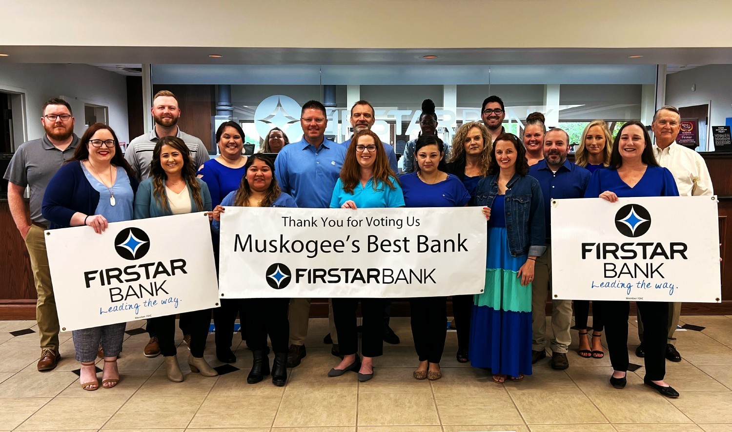 Firstar Bank employees celebrate being voted Best Bank in Muskogee, OK.