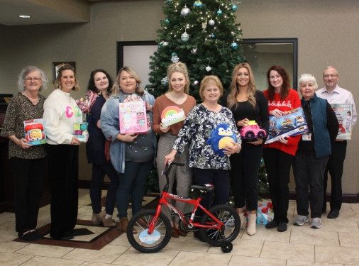 Sallisaw employees collecting donations for Toys for Tots Fundraiser.