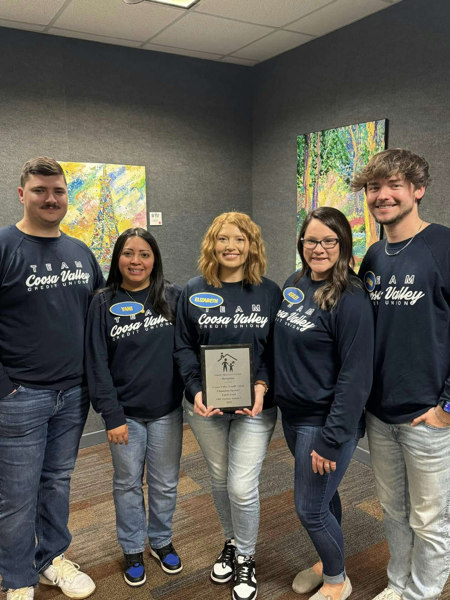 Employees compete in Family Resource Center Family Feud fundraiser.